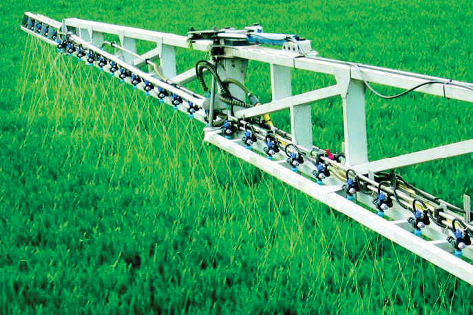 Spray nozzles spraying the field