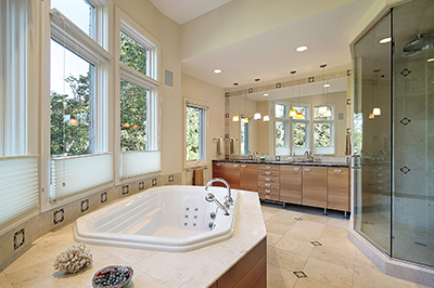 Master bath in luxury home with glass shower