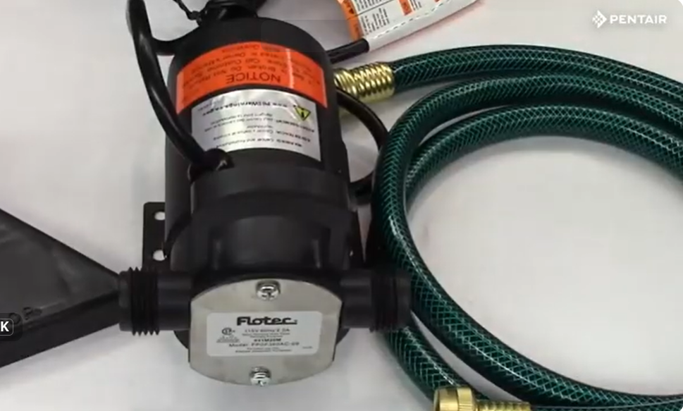 Flotec FP0F360AC CYCLONE™ utility pump with hose and suction attachment ready for operation.