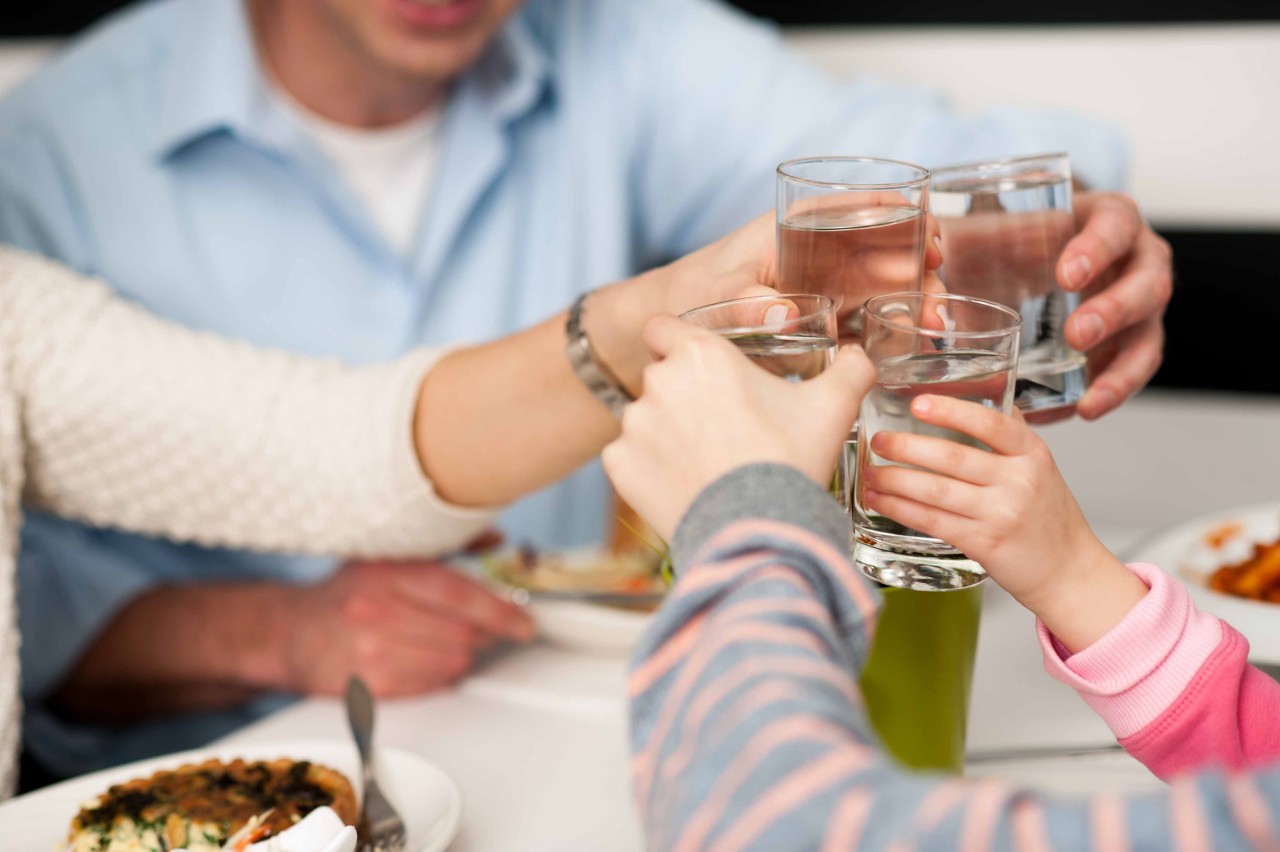 It's time to celebrate. Family toasting in restaurant