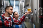 beer-brew-man-woman-in-brewery-inspecting-beer-glass-cropped-horizontal-800x533-image-file-452734891