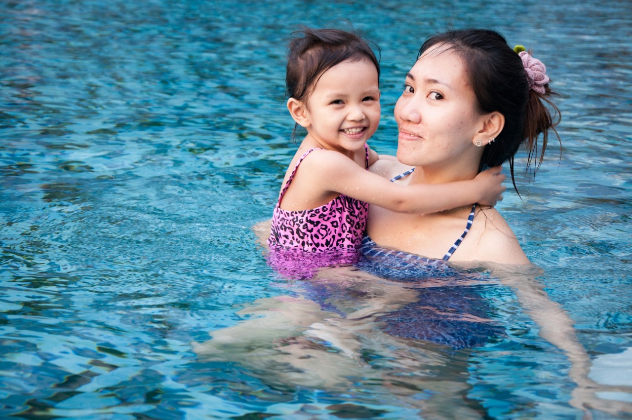 mother and daughter in pool mother and daughter in pool