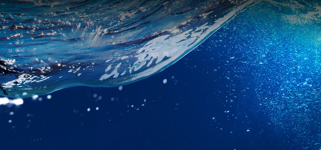 clear-blue-ocean-wave-with-bubbles-cropped-horizontal-1440x672-image-file