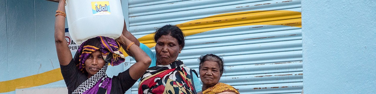 Three women and an iJal water jug