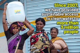 Three women and an iJal water jug, with text