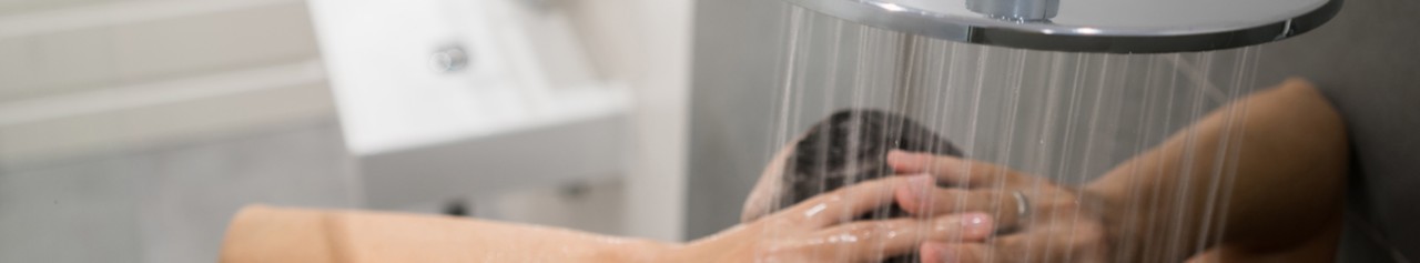 Woman in shower, overhead