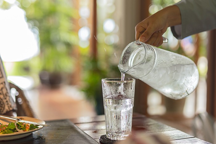 two children drinking water