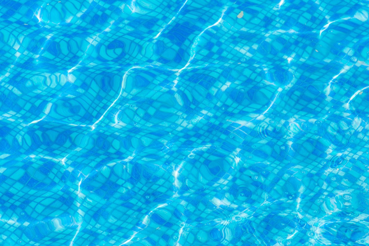 Texture of blue water in the pool