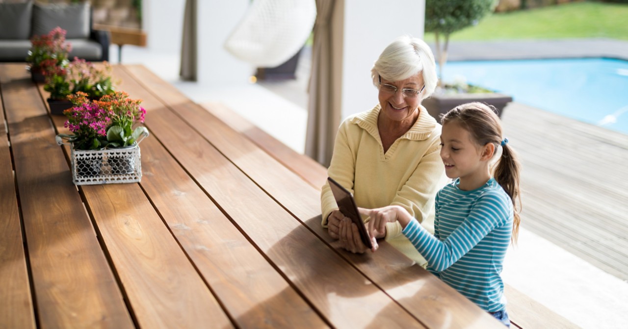 grandma and grandaughter on tablet