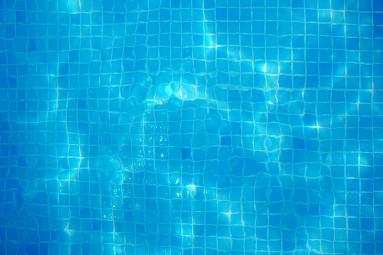 Mosaic tiled pool bottom with caustic lighting