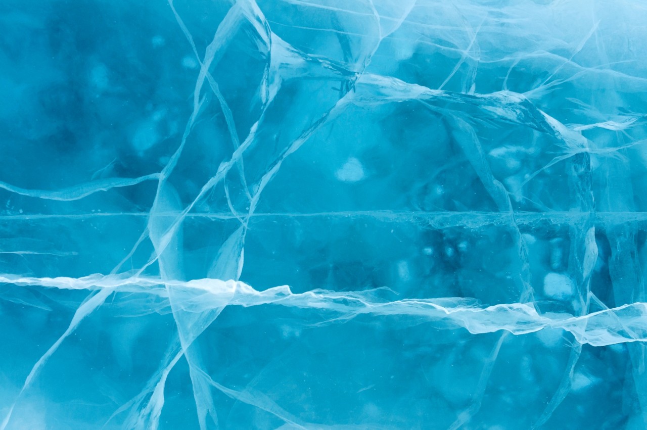 Network of cracks in thick solid layer of ice of a frozen river; Shutterstock ID 137856428; purchase_order: January Pool Images; job: 
