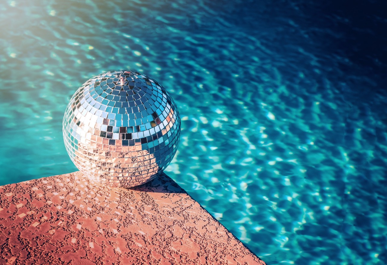 Party rave event disco ball beside swimming pool ; Shutterstock ID 637527289; purchase_order: December Pool Images; job: 