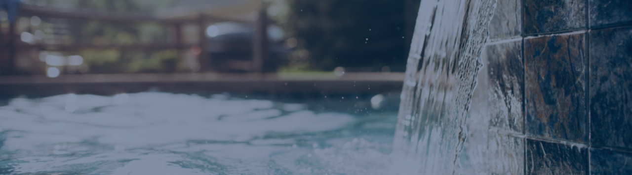 Water flowing into pool from spa waterfall