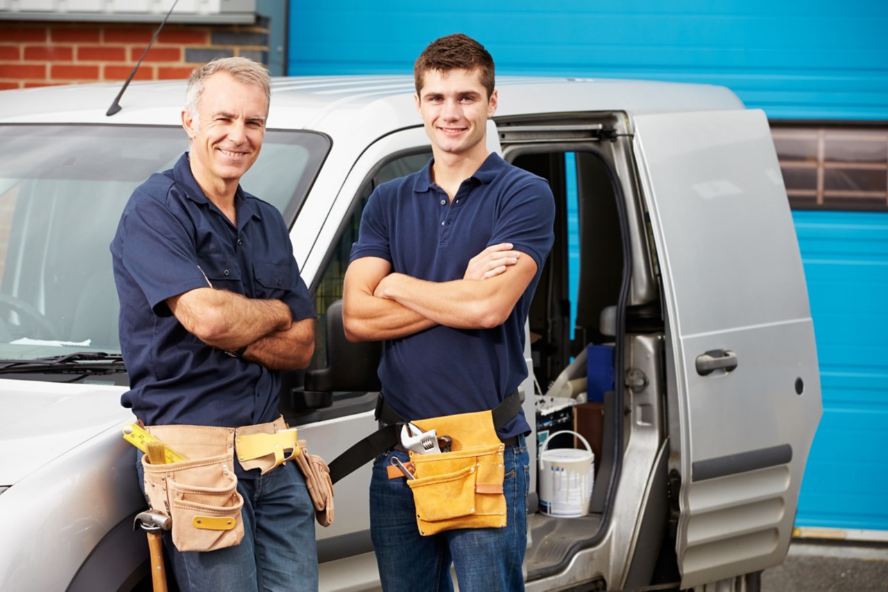 Professionals in front of van