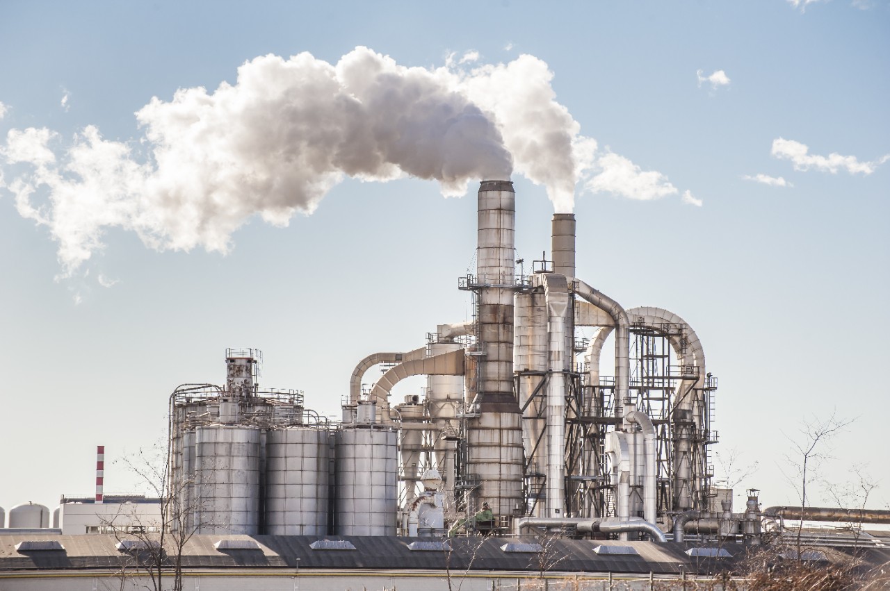 chemical-plant-silos-and-smokestacks-of-factory-on-sunny-day-with-blue-sky-horizontal-4256x2832-image-file