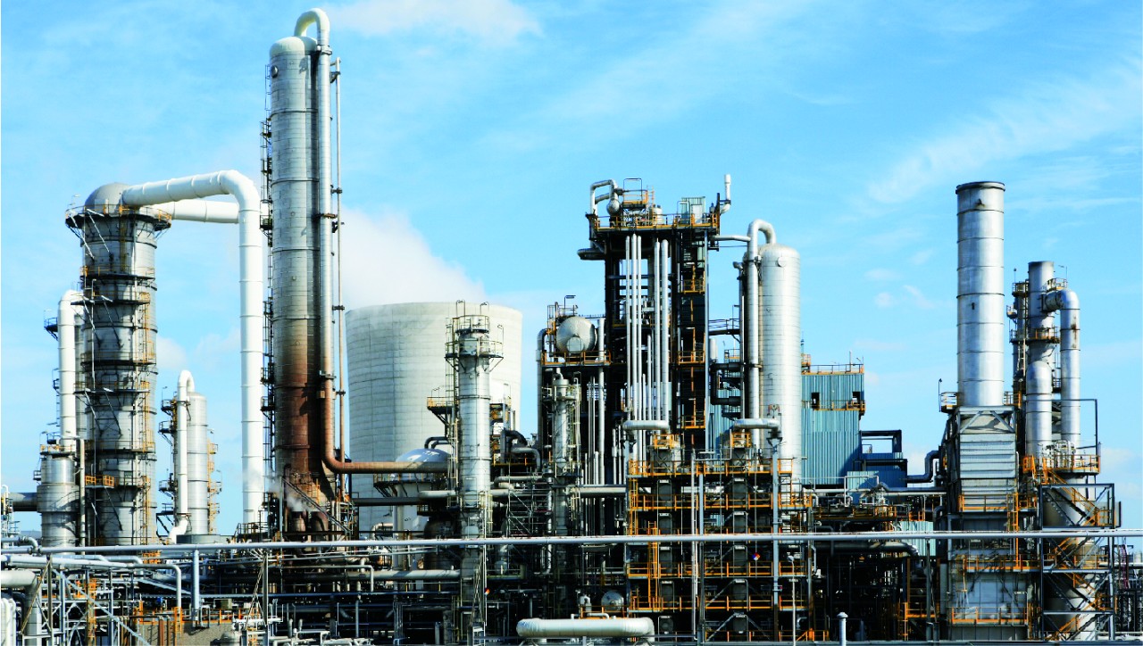 chemical-factory-equipment-skyline-during-day-with-blue-sky-horizontal-1426x807-image