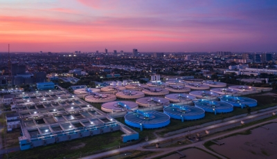 aerial-view-water-treatment-plant-at-dusk-with-cityscape-for-municipal-water-supply-view-2.jpg