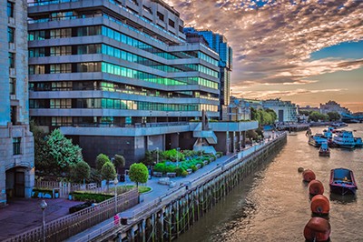 London commercial buildings as seen from the London Bridge over river Thames, London