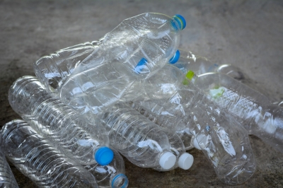 Plastic water bottles on cement floor.To be recycle