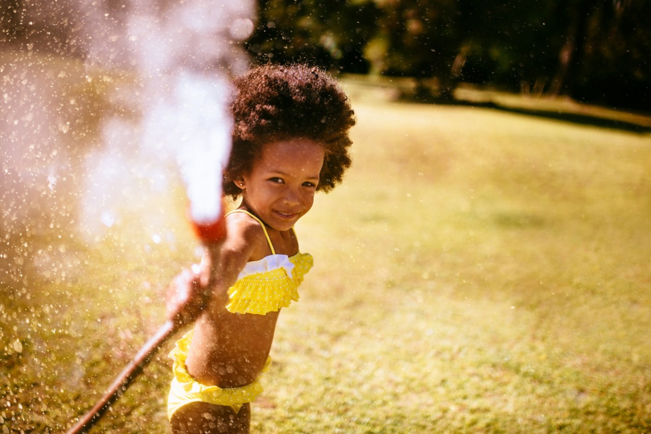 Girl spraying hose