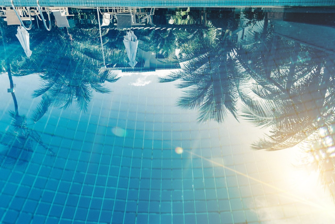 sun reflecting in pool