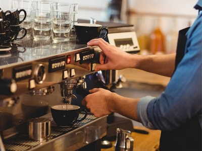 Barista with espresso machine; Adobe Stock: 128864939