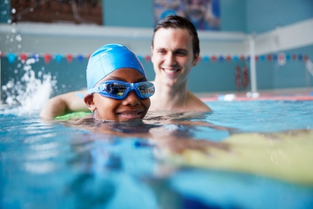 girl taking swimming lessons