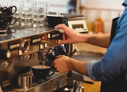 Barista with espresso machine; Adobe Stock: 128864939