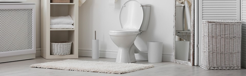 Clean bathroom with toilet 
