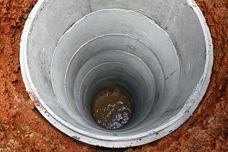 Groundwater at the bottom of a hole drilled for a well.