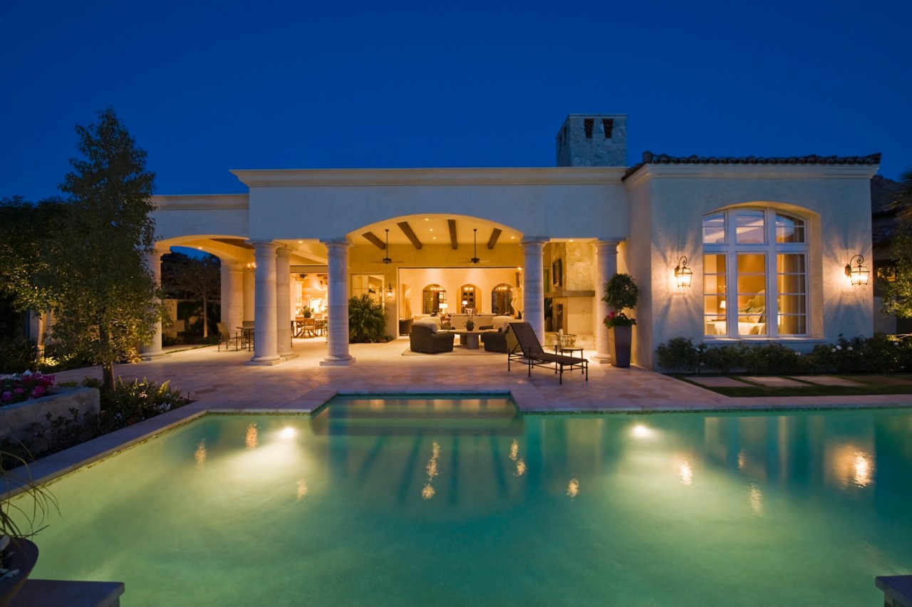 Luxury pool at mansion at night