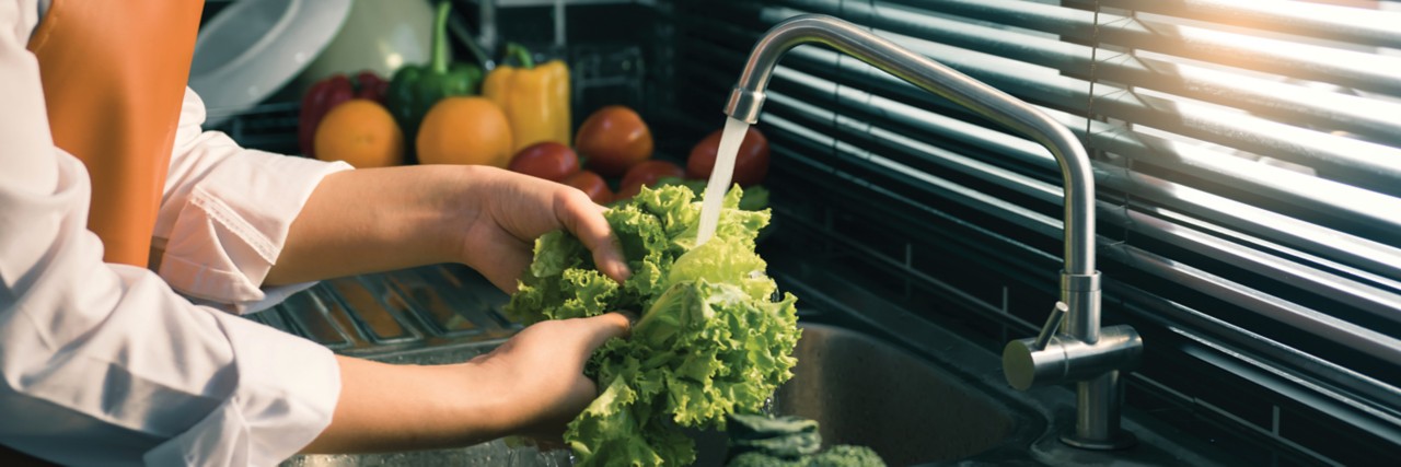 hands woman washing vegetables salad and preparation healthy food in kitchen; Adobe Stock: 383410053