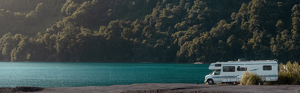 RV by water and mountain; Adobe Stock: 300874021