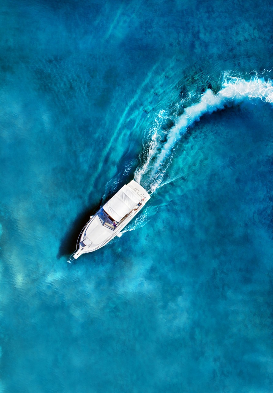 amazing view to yacht, swimming woman and clear water caribbean paradise