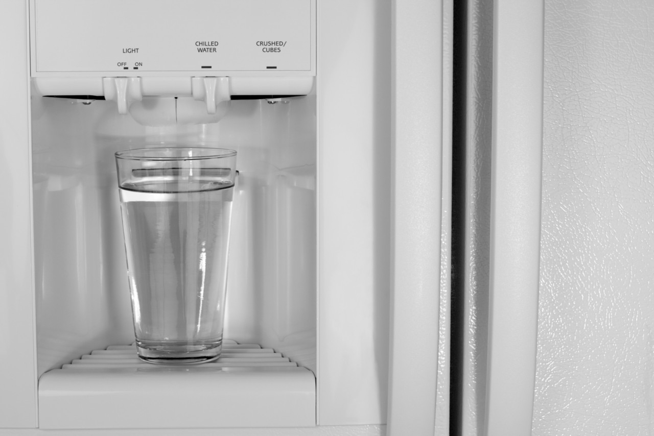 Glass of Refreshing Cold Water from the water dispenser of a refrigerator.