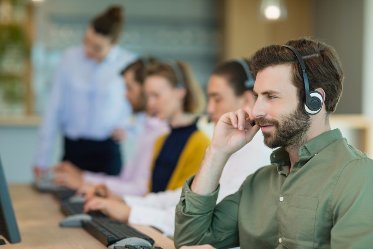 Team of customer service executives working in call center