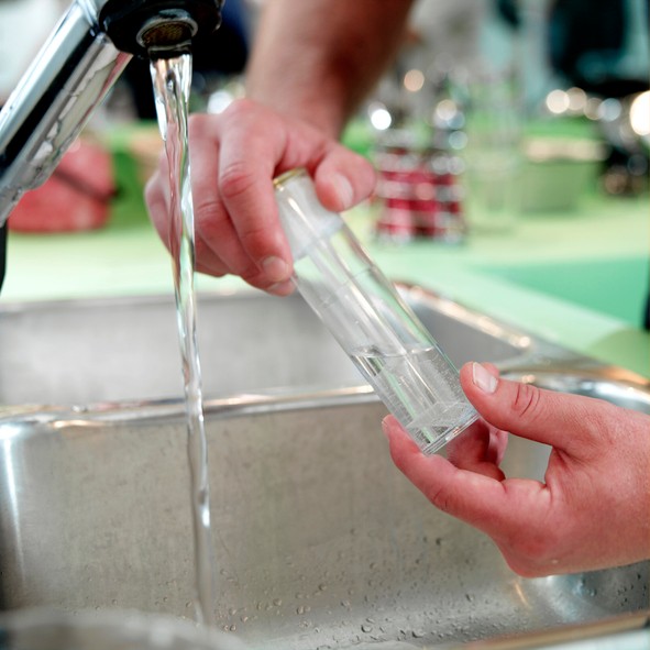 Testing well water from a kitchen tap, selective focus; Gettyimages: 157335521